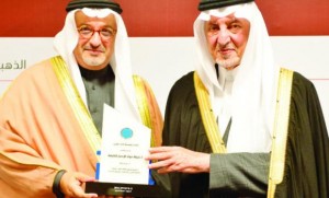 Prince Khaled Al-Faisal, minister of education, honors Faysal Alaquil, CPC’s director of business developmen