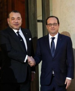 France's President Francois Hollande, right, and Morocco's King Mohammed VI shake hands after a meeting at the Elysee Palace, in Paris, France, Monday, Feb. 9, 2015. (AP Photo/Christophe Ena) 