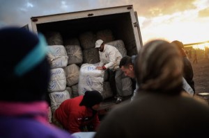 People unload large bales of goods that will be carried across the border into Morocco(David Ramos/Getty Images)