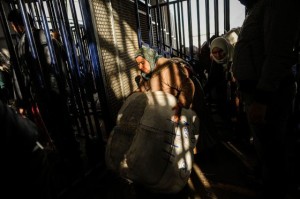 A Moroccan woman carries a large bale through the Barrio Chino border crossing(David Ramos/Getty Images)