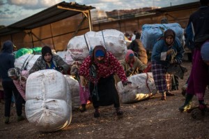 Women known as Porteadoras carry heavy bales of goods across the border between the Spanish enclave of Melilla and Morocco(David Ramos/Getty Images