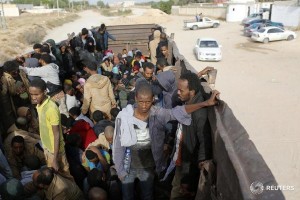 African migrants are transferred to a detention centre after being detained in Zawiya, northern Libya